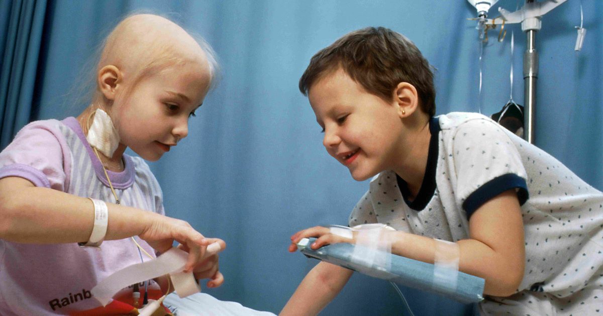 Two children play together during hospital treatment.