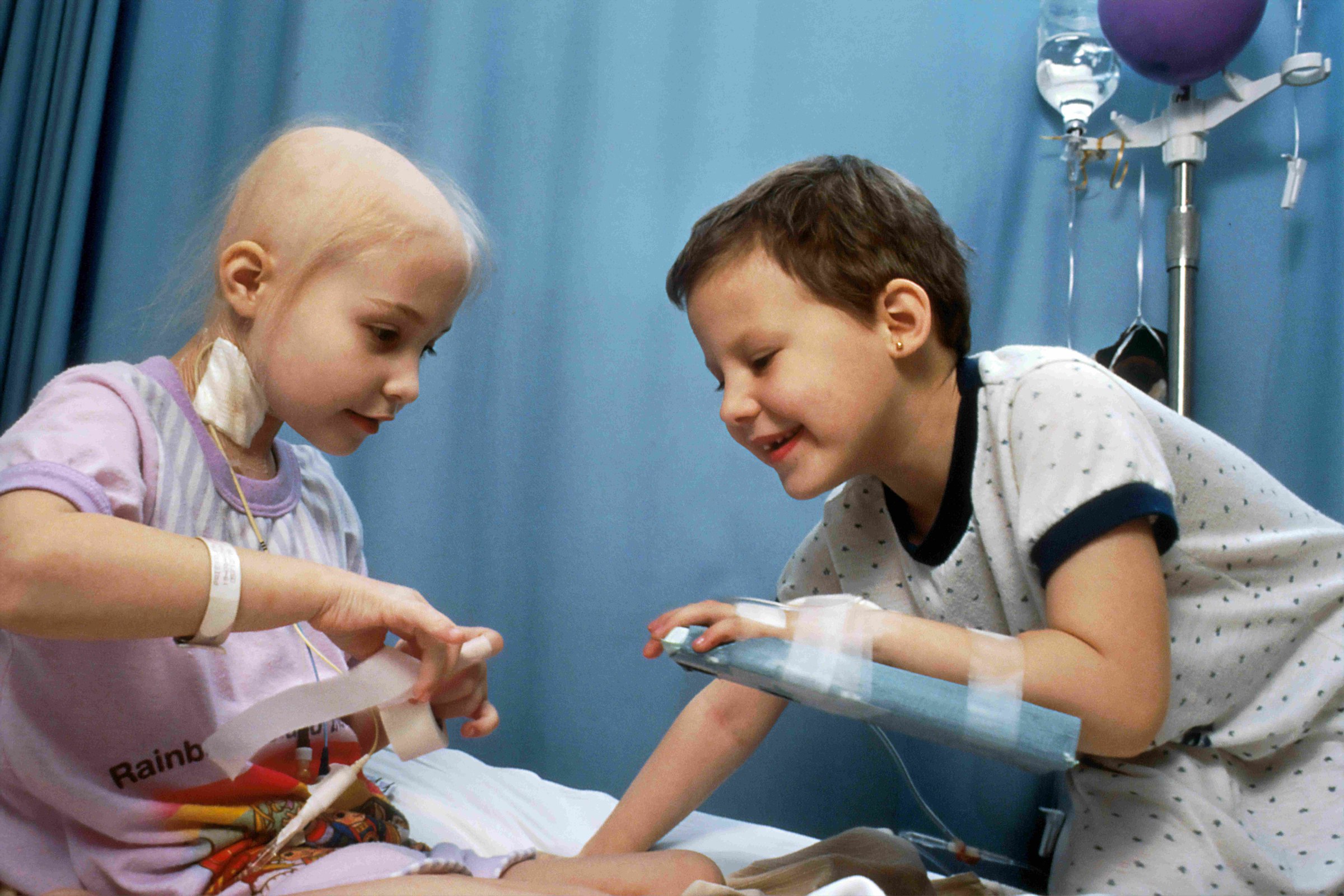 Two children play together during hospital treatment.
